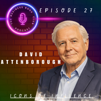 David Attenborough smiling against a brick wall backdrop with a microphone graphic.